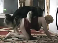 Older woman enjoys having sex with a dog