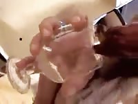 Woman milks her canine for cum