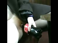 Cock wanting amateur coed with nice breasts uses soda bottle for insertion pleasure in this vid